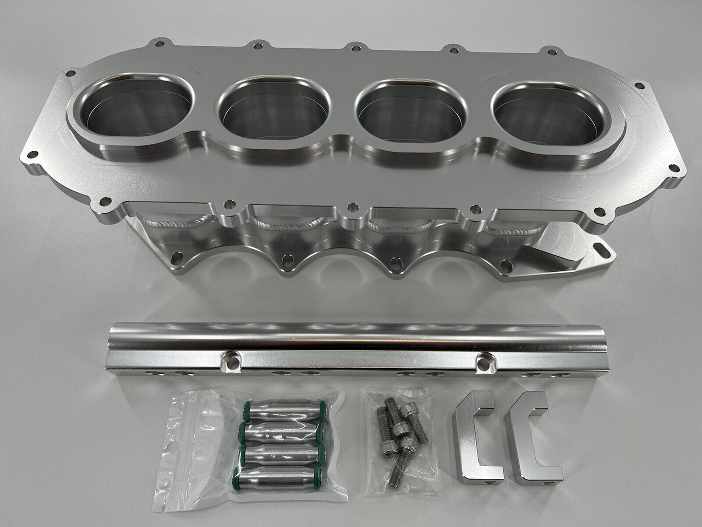 Jack Spania Racing billet B Series intake manifold adapter kit for Skunk2 Ultra Plenum, engine parts shown in the image.