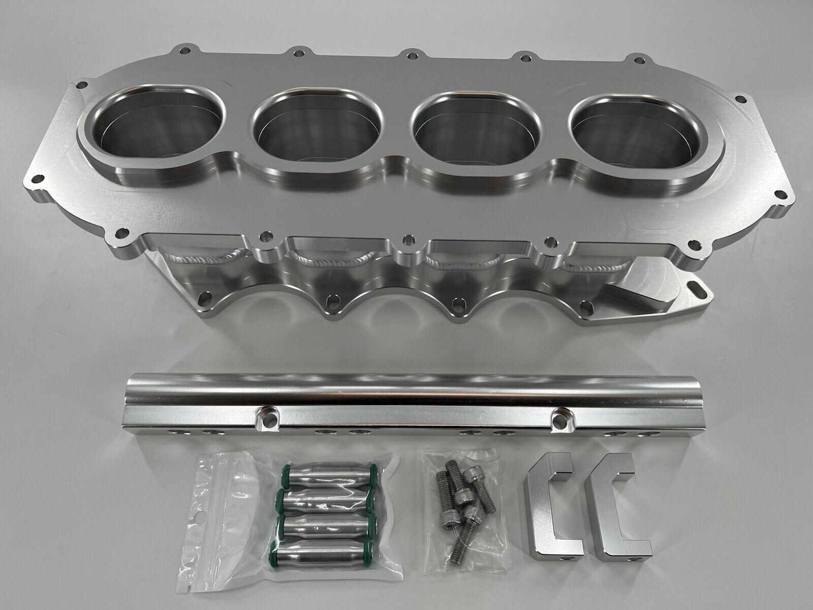 Jack Spania Racing billet B Series intake manifold adapter kit for Skunk2 Ultra Plenum, engine parts shown in the image.