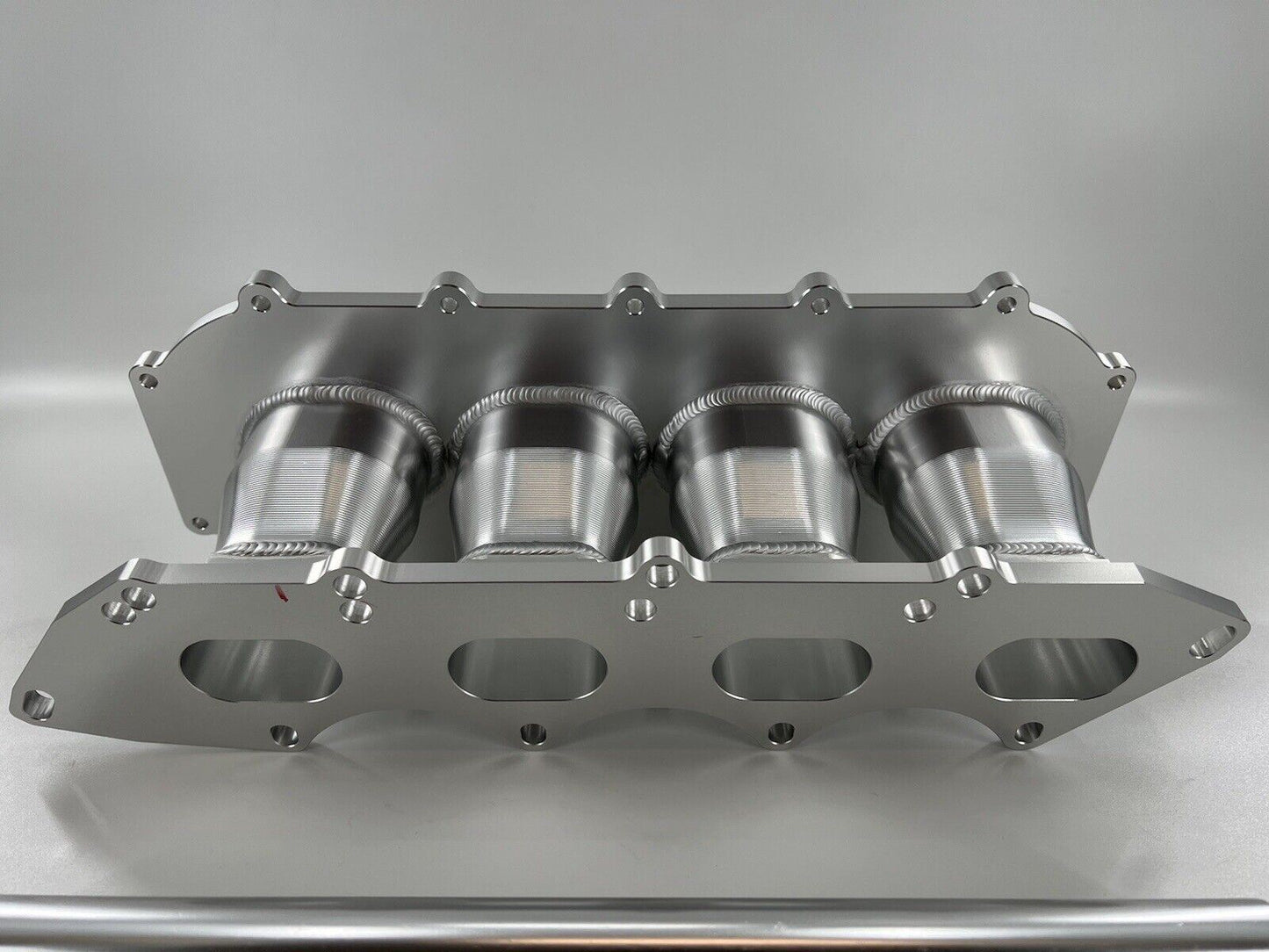 Jack Spania Racing billet B Series intake manifold adapter kit for Skunk2 Ultra Plenum engine parts, shown with mounting details.