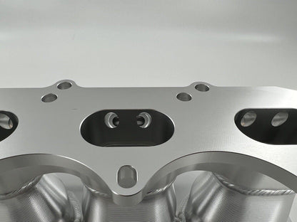 Jack Spania Racing Billet B Series Intake Manifold Adapter Kit for Skunk2 Ultra Plenum engine parts, showing the metal components.