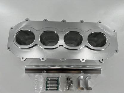 Jack Spania Racing billet B Series intake manifold adapter kit for Skunk2 Ultra Plenum engine upgrade, showing the precision-machined metal parts.