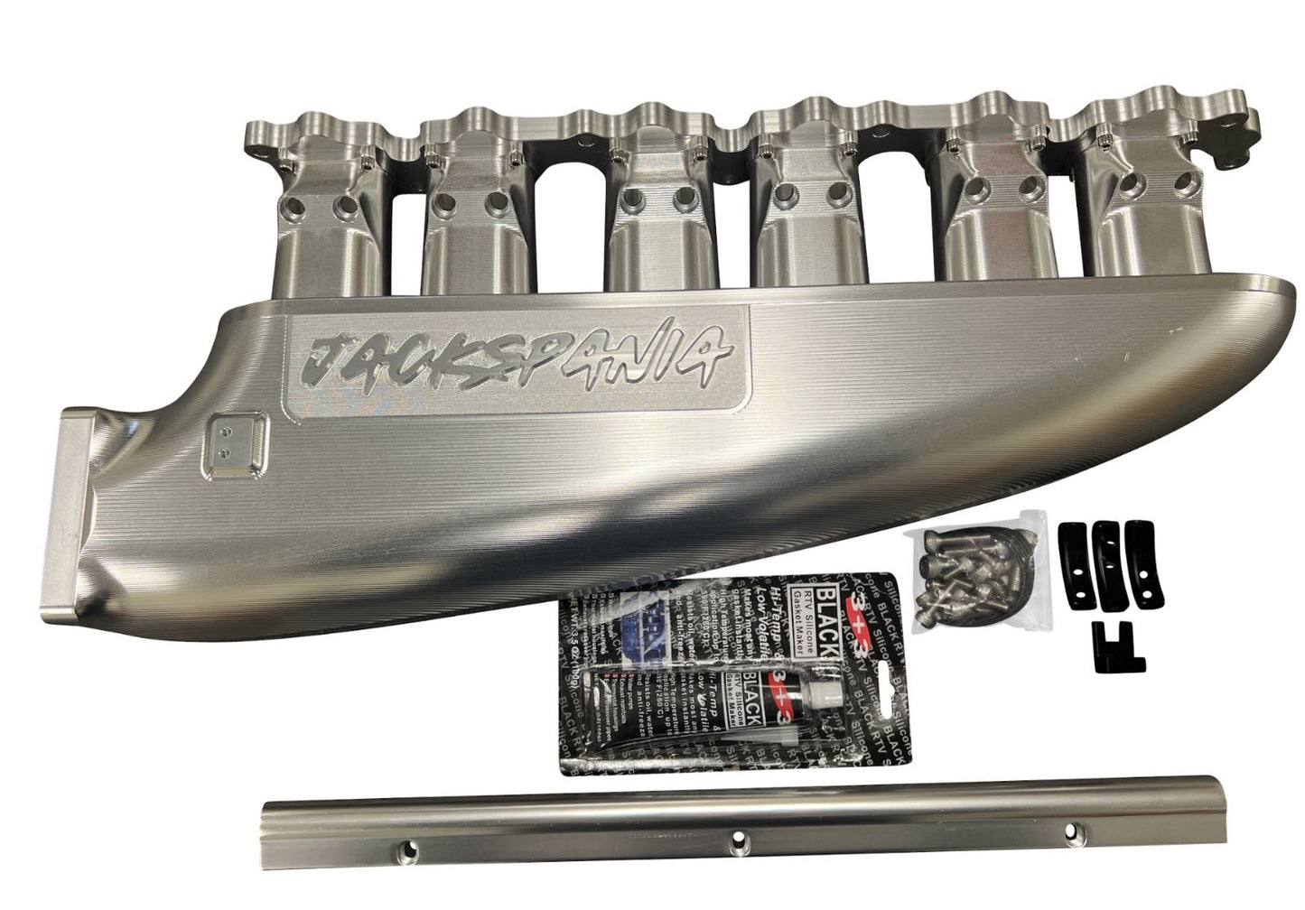 Jack Spania Racing fully billet 2JZ GTE intake manifold with throttle body and six injectors installed on a high-performance engine.