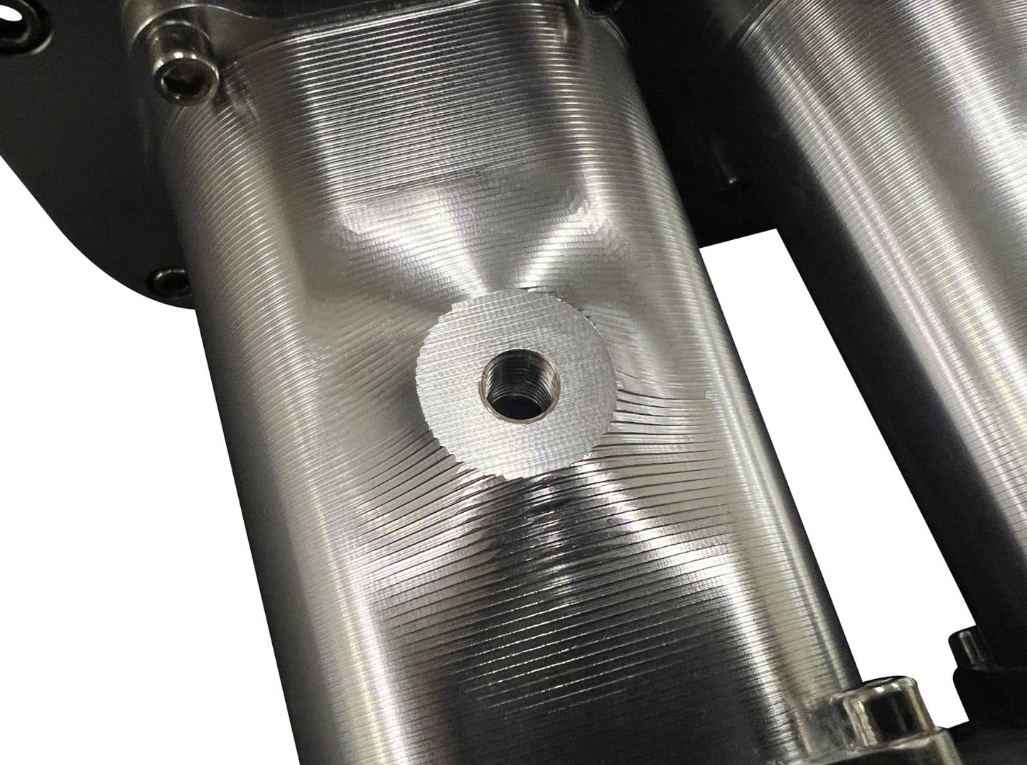 Fully billet 2JZ GTE intake manifold with 6 12 injector ports and throttle body, by Jack Spania Racing engine parts.
