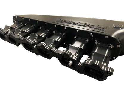 Jack Spania Racing 2JZ GTE intake manifold with 12 injector fuel rail and throttle body for Toyota engine performance.