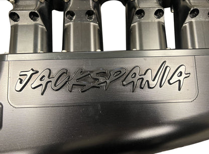 Jack Spania Racing 2JZ GTE intake manifold with 12 injector fuel rail and throttle body for Toyota engine performance.