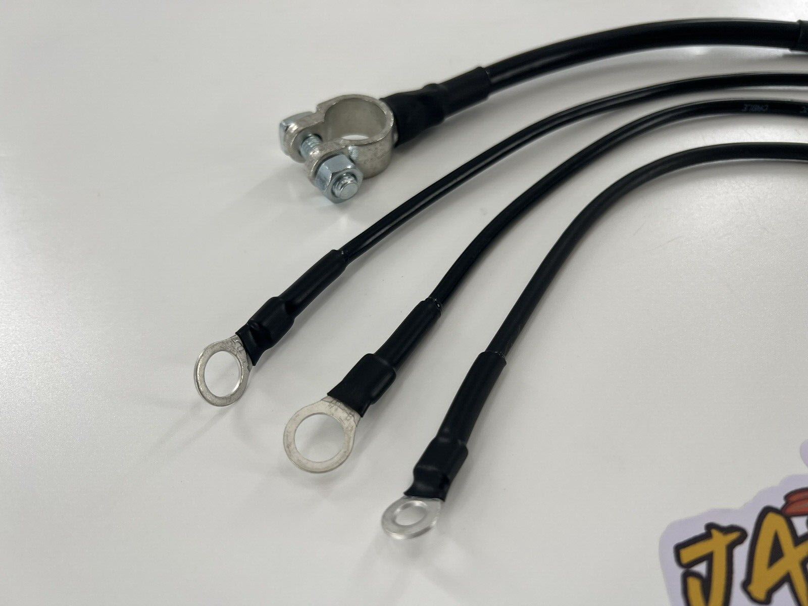 Heavy duty battery ground strap kit for Honda Acura B D H K Series engines, designed for transmission grounding by Jack Spania Racing.
