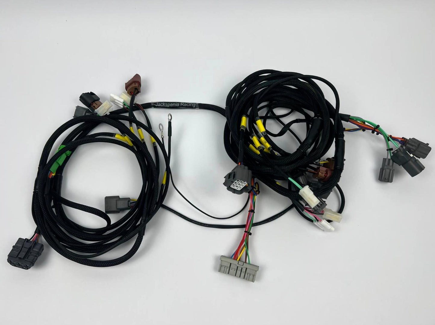 JackSpania Racing front end headlight wire tuck harness for Acura Integra DC, compatible with USDM blinkers and Civic engine parts.