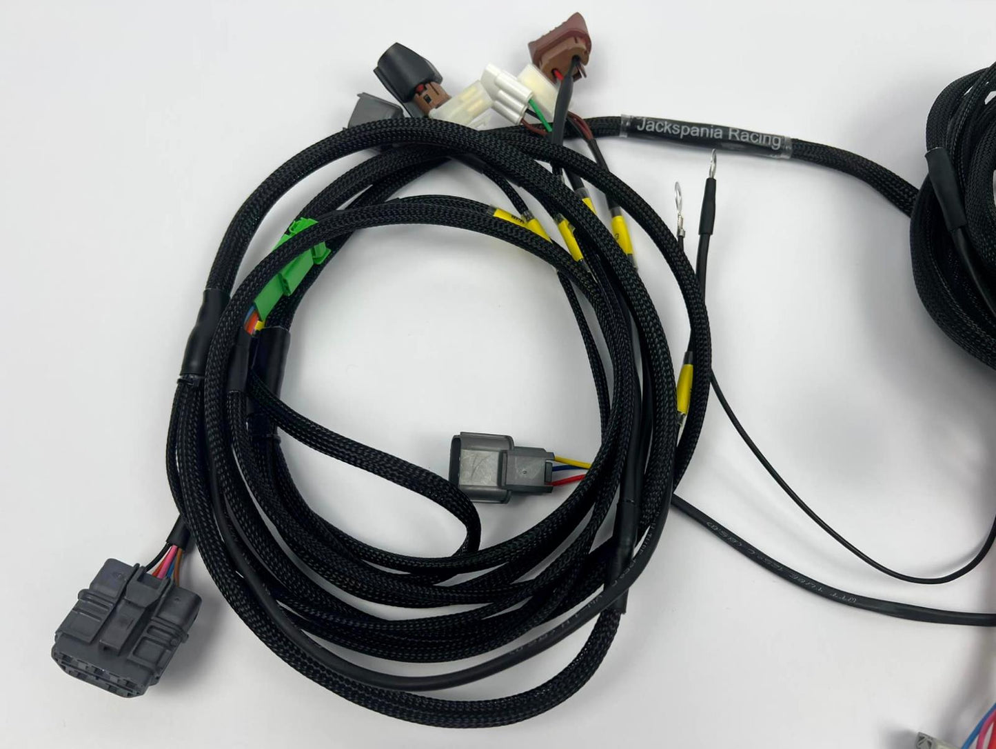 JackSpania Racing front end headlight wire tuck harness for Acura Integra DC and Civic engine parts, with blinker connections shown.