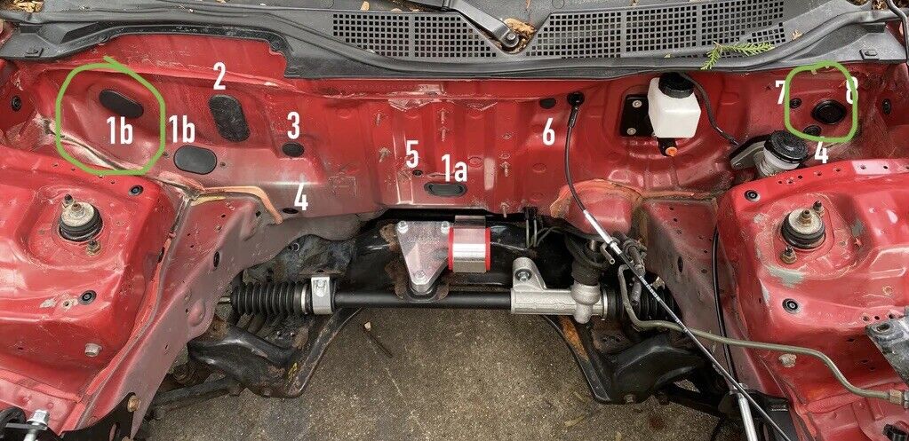Exterior image of JackSpania Racing Billet Firewall Harness Block Plug Kit for Honda Acura Civic hatch Si DC2, showing the black metal plugs.