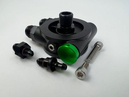 JackSpania Racing billet 10AN ORB thermostatic oil sandwich plate adapter with M20 x 1.5 threading and 180-degree design.