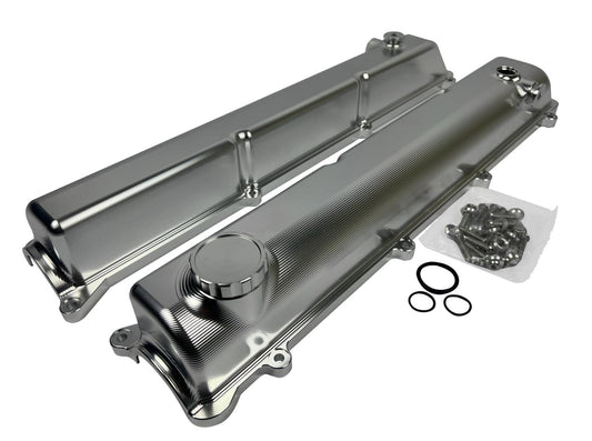 Toyota Supra 2JZ Billet Valve Covers with anodized oil cap bolts, engine parts by JackSpania Racing, showing detailed metal finish.
