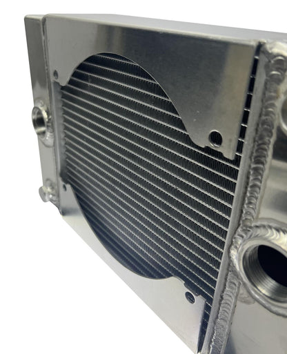 JackSpania Racing half-size compact drag tuck coolant radiator with 1.25-inch 16AN fittings and 4-row core for engine cooling.
