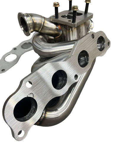 JackSpania Racing K20 K24 top mount manifold with 44mm wastegate, compatible with T3/T4 turbo, for AWD and FWD exhaust systems.