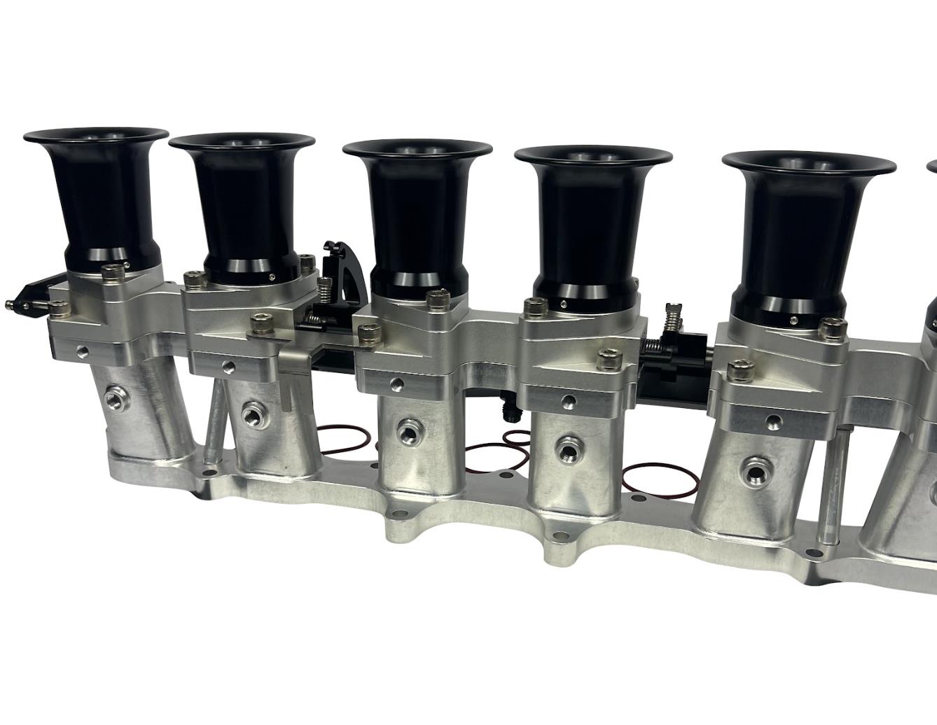 JackSpania Racing intake manifold with individual throttle bodies and fuel rail for 2JZGE engine, engine parts for performance tuning.