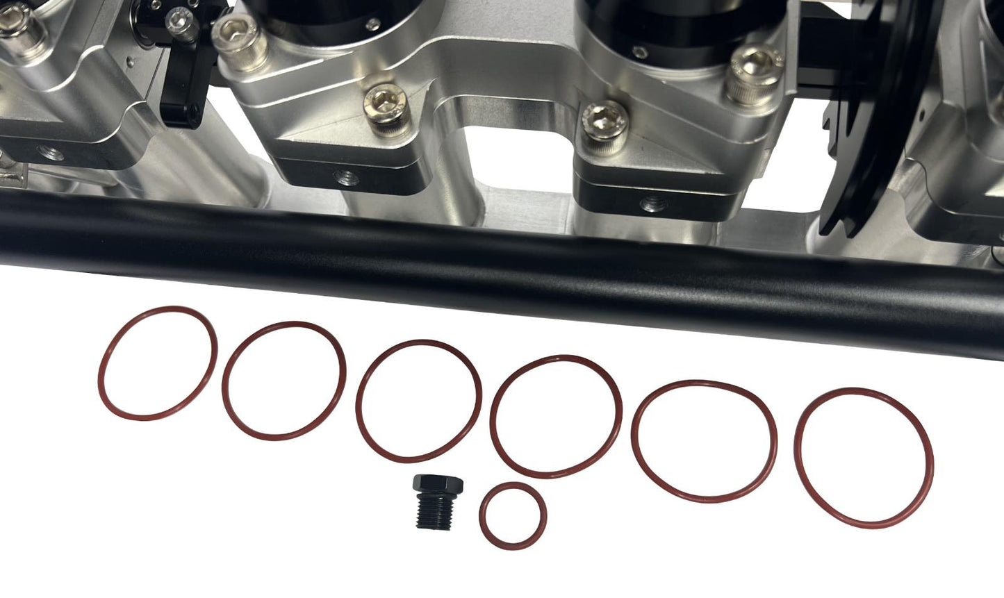 JackSpania Racing 2JZGE intake manifold with individual throttle bodies and fuel rail for engine performance.