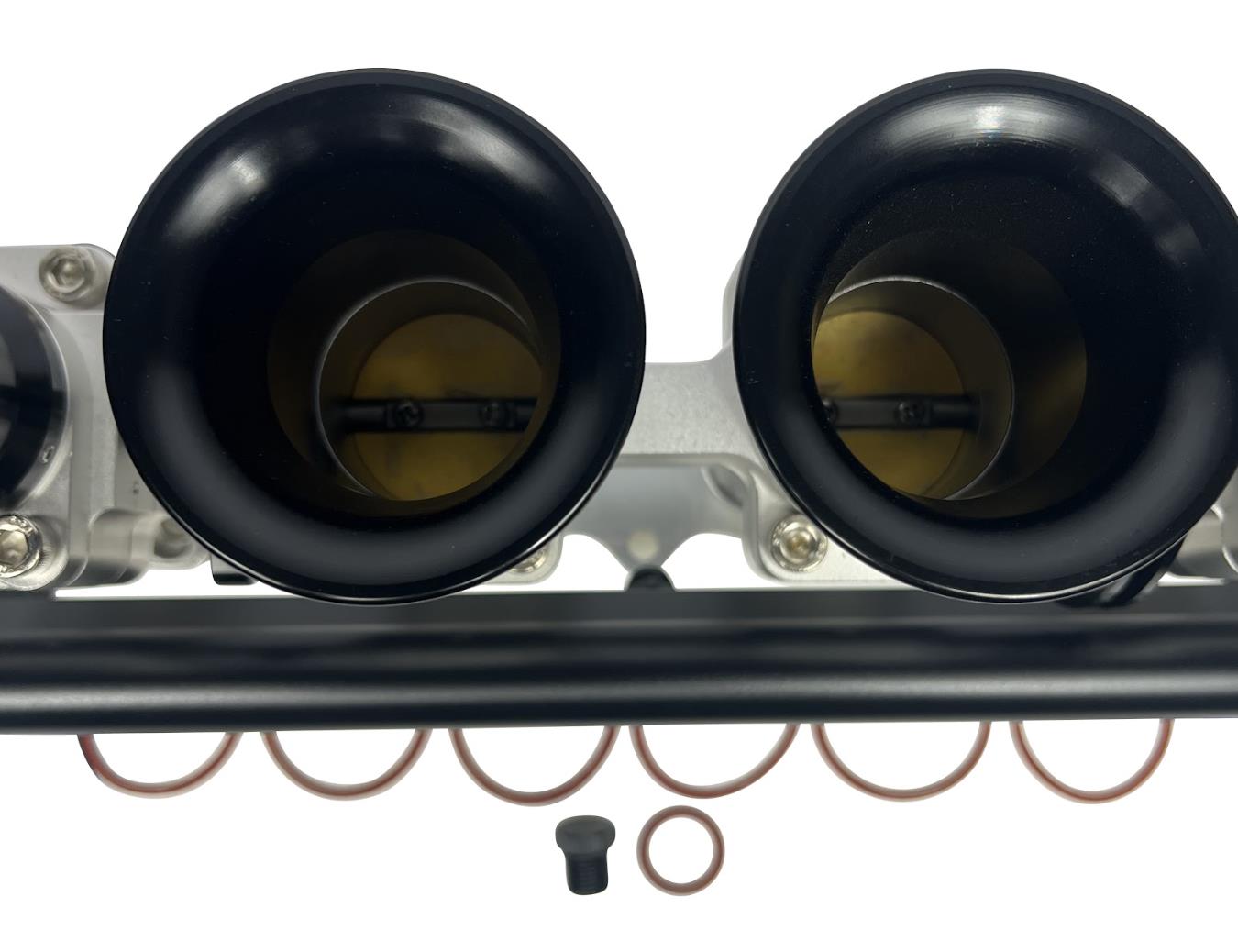 JackSpania Racing 2JZGE intake manifold with individual throttle bodies, fuel rail, and engine parts for enhanced performance.
