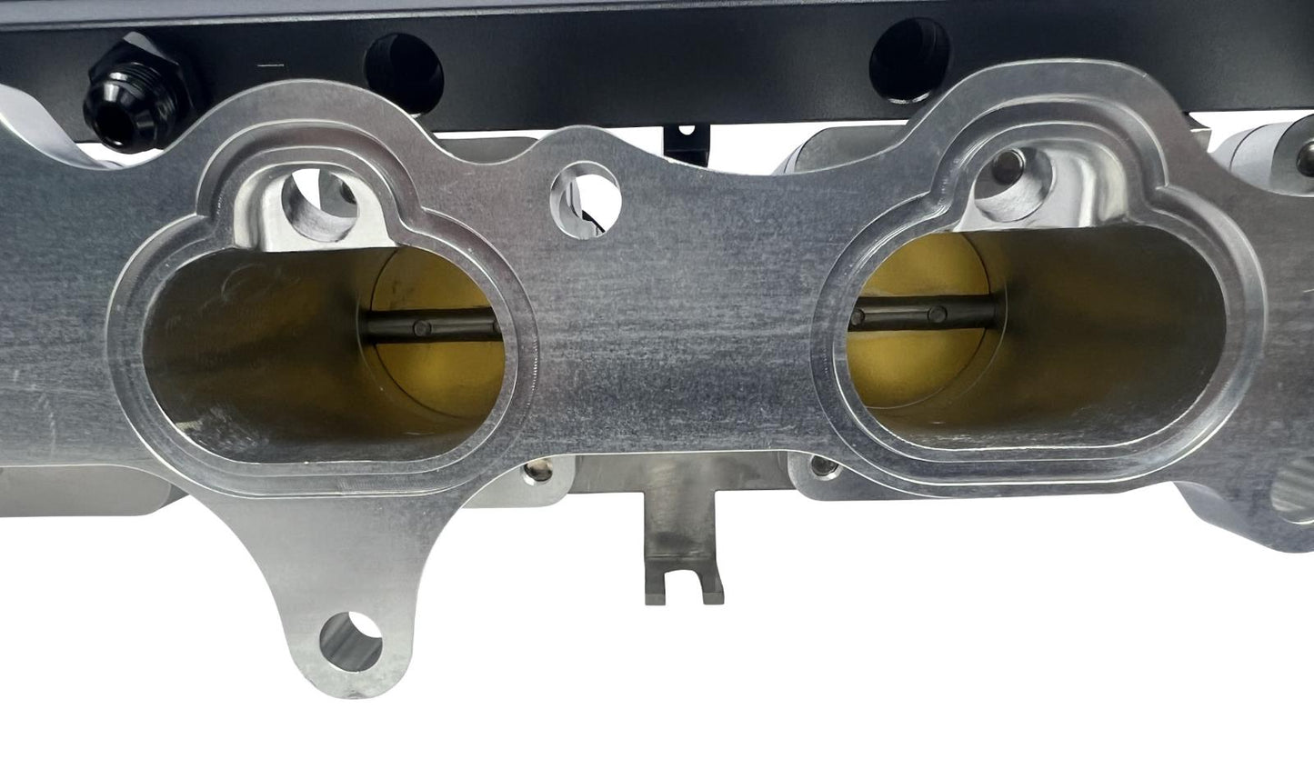 JackSpania Racing 2JZGE intake manifold with individual throttle bodies, fuel rail, and engine parts for performance tuning.
