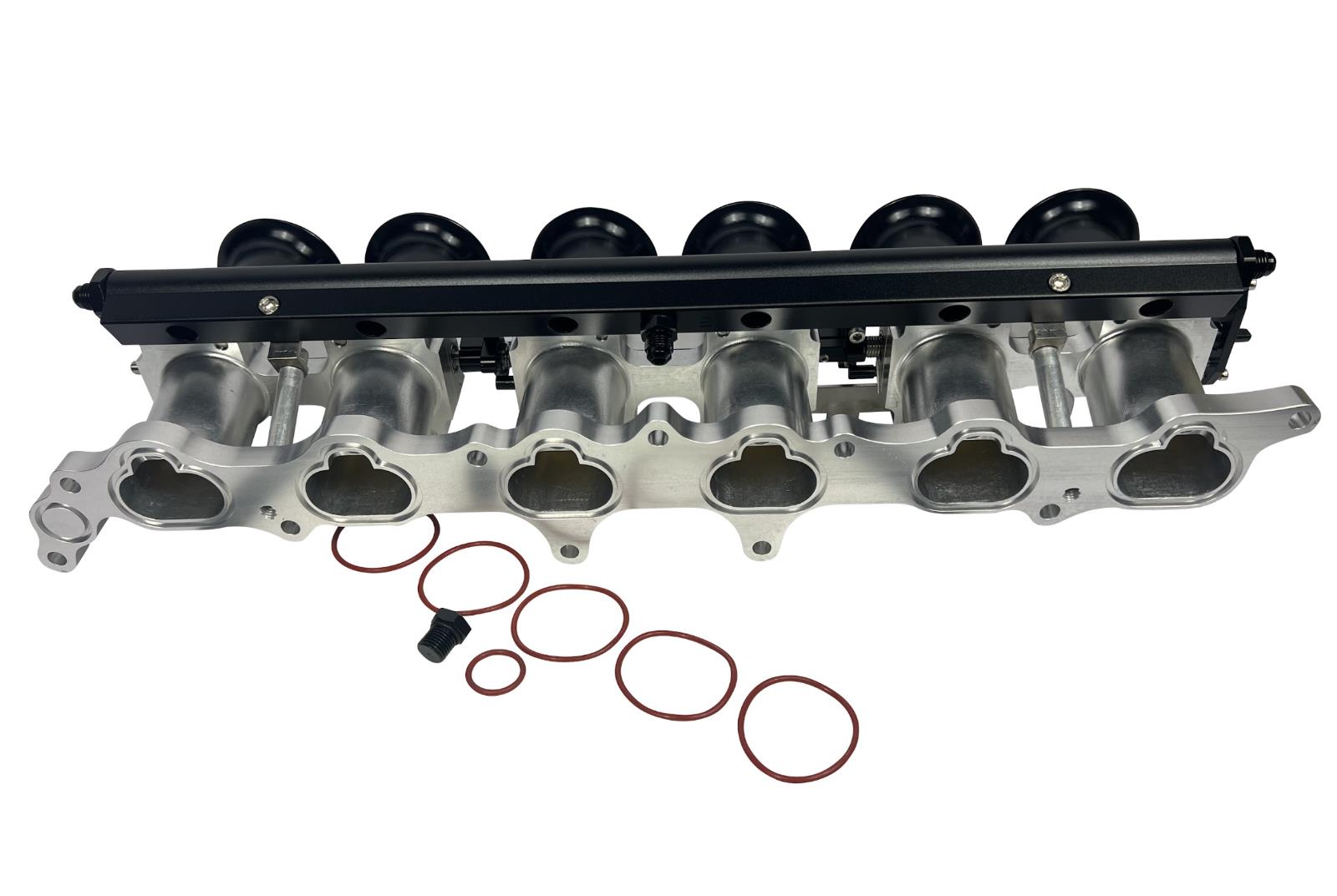 JackSpania Racing 2JZGE intake manifold with individual throttle bodies, fuel rail, and engine parts for performance engines.