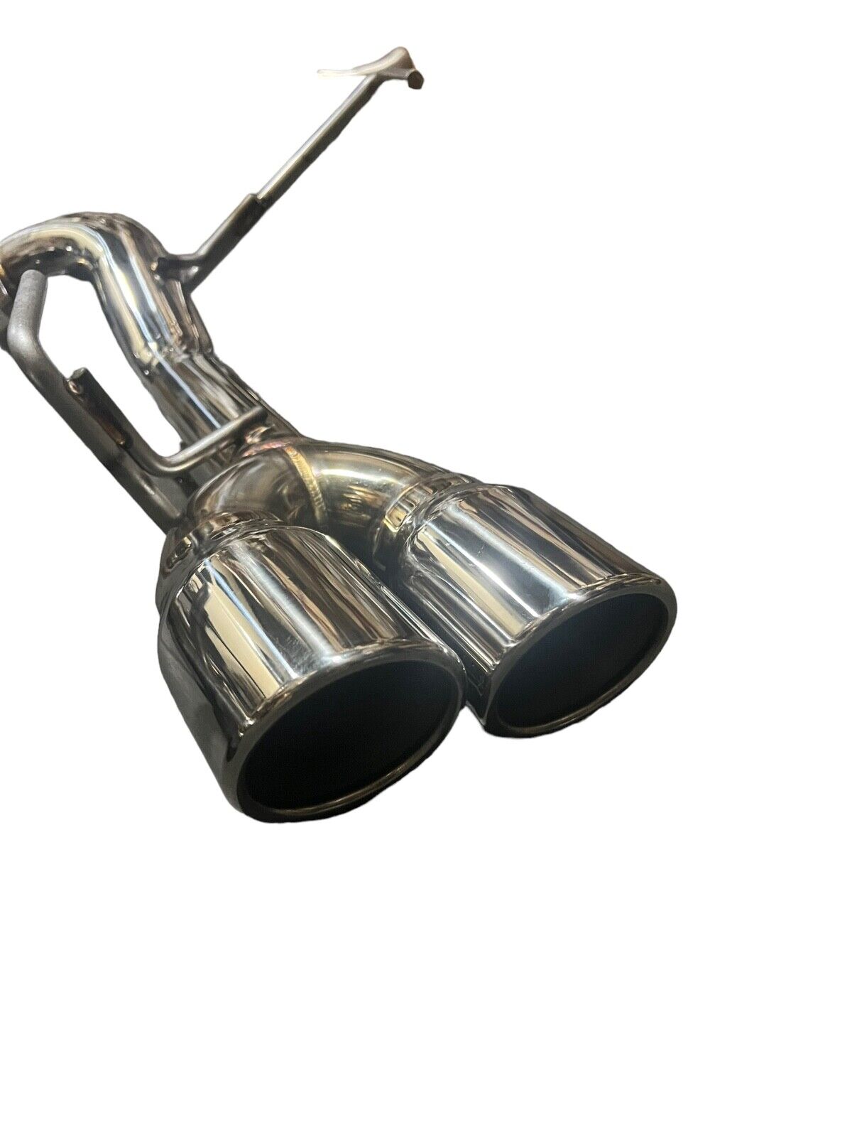 Stainless steel axle back delete exhaust muffler for Subaru WRX by JackSpania Racing, showing the polished metal and exhaust outlet.