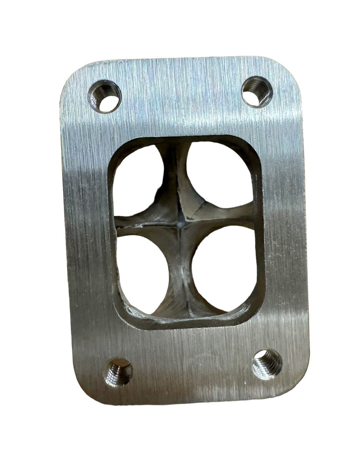 304 stainless steel 4-1 turbo merge collector with T2 flange for engine performance by JackSpania Racing, shown from angle.