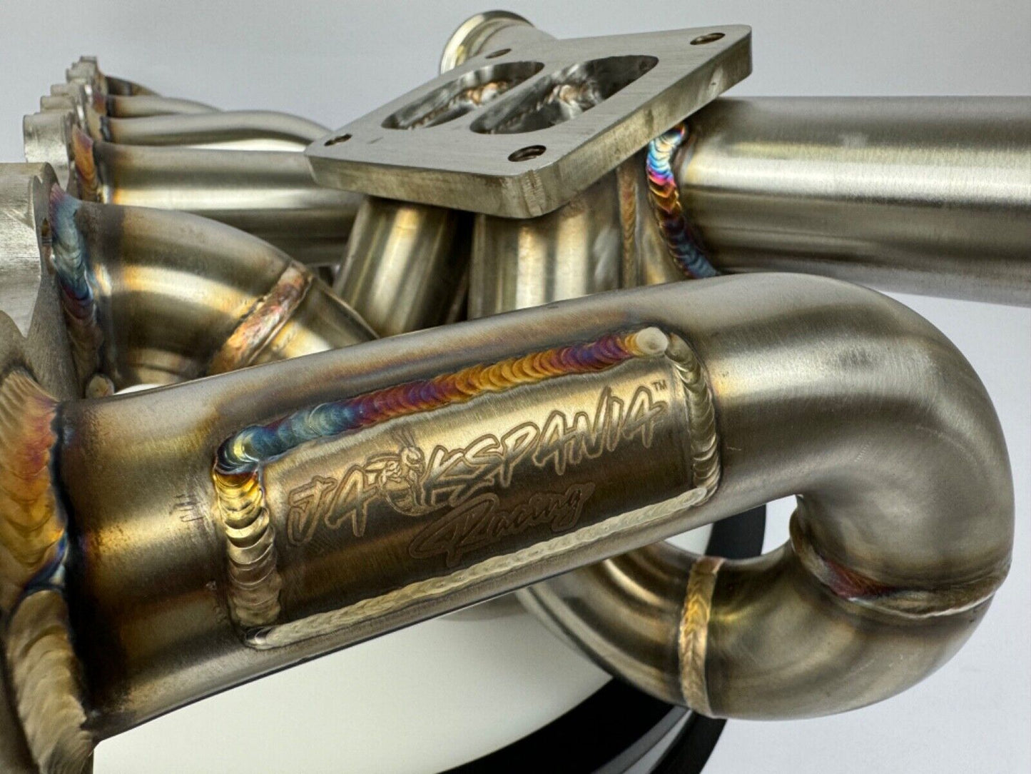 JackSpania Racing RB20 RB25 RB26 T4 top mount turbo manifold for Nissan GTR, 44mm twin scroll exhaust part with metal construction.