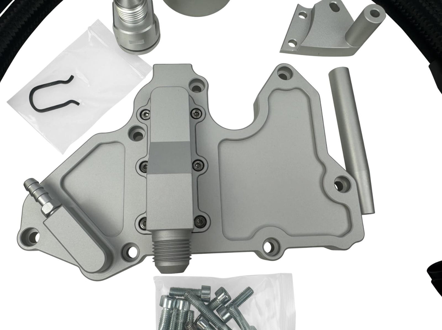 JackSpania Racing billet oil catch can for VW MK7 Golf GTI 1.8T TSI 2.0T turbo engine, with breather hoses kit visible.