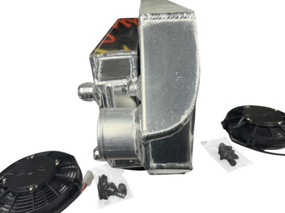 JackSpania Racing backdoor front mount intercooler with dual 3-inch pipes and full-size radiator, exterior view with 16AN fittings.