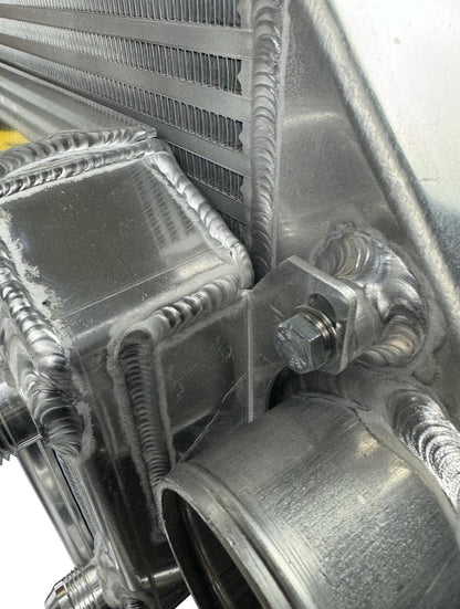 JackSpania Racing front mount intercooler and full size radiator combo with dual 3-inch outlets and 16AN fittings, exterior view.