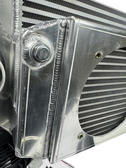 JackSpania Racing front mount intercooler and full-size radiator combo with dual 3-inch ducts and 16AN fittings, exterior view.