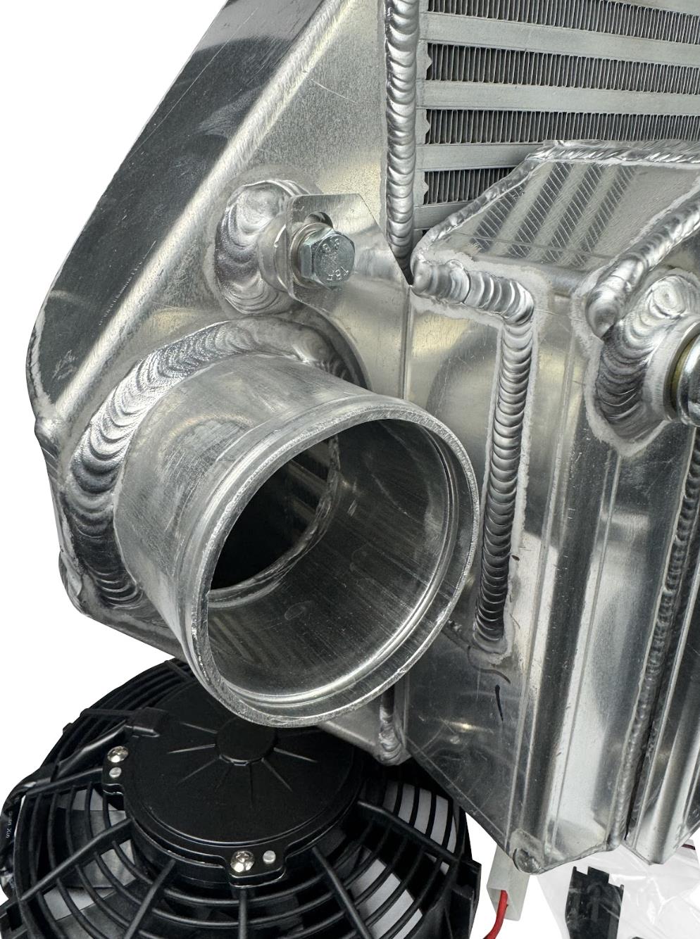 JackSpania Racing backdoor front mount intercooler with dual 3-inch pipes and full-size radiator, exterior view.