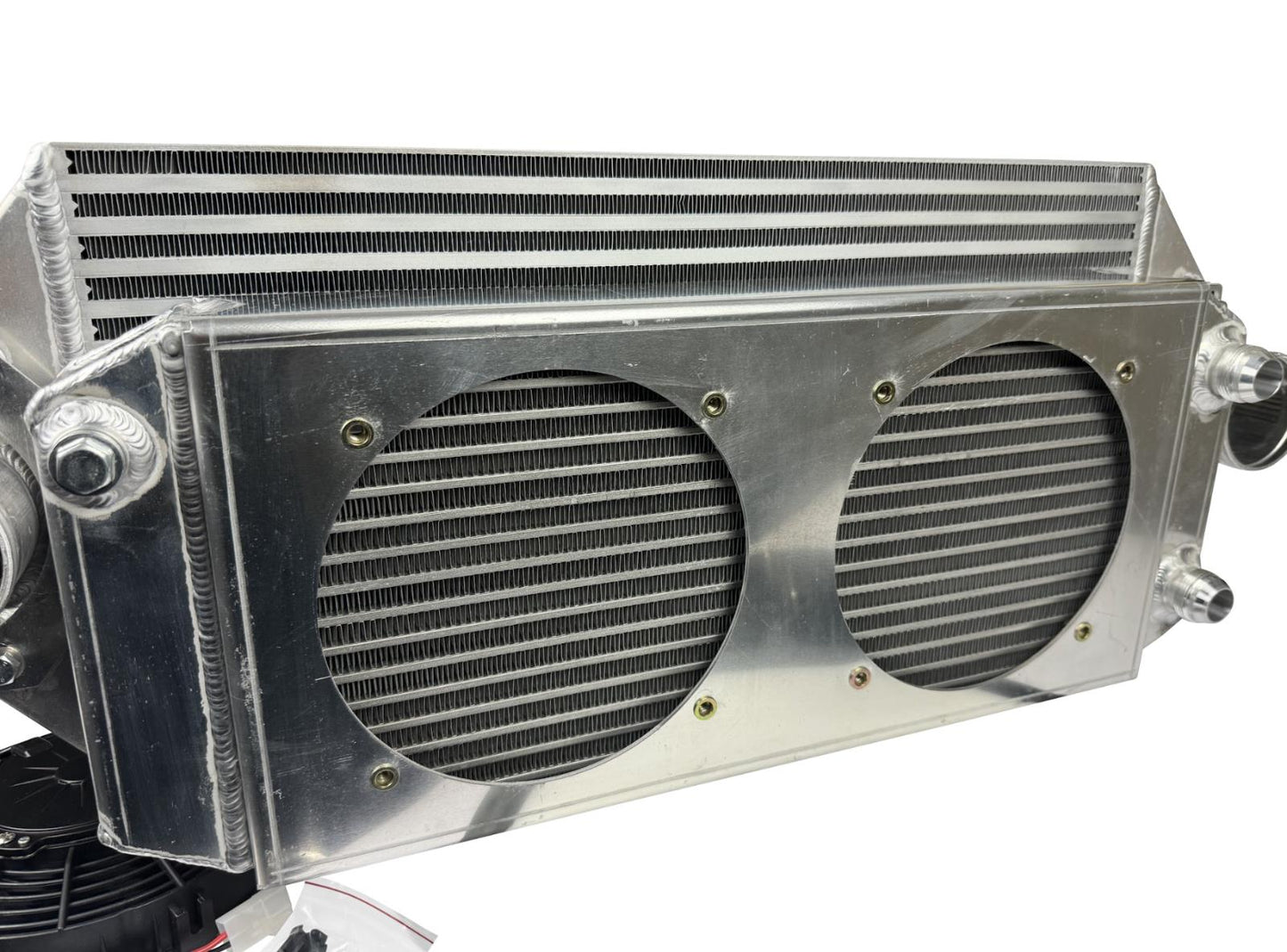 JackSpania Racing backdoor front mount intercooler with dual 3-inch pipes and full-size radiator, featuring 16AN fittings.