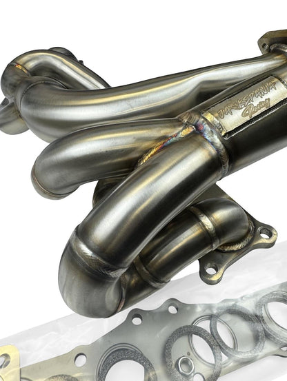 JackSpania Racing N54 top mount single front-facing turbo manifold for 135i, 335i, 535i, and Z4 with T3 T4 divided exhaust design