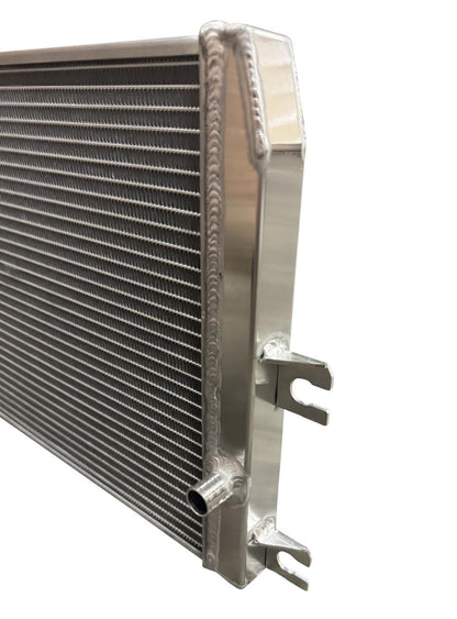 XL Performance Heat Exchanger for 2023+ Nissan Z VR30 engine parts by JackSpania Racing, showing the core and fittings.