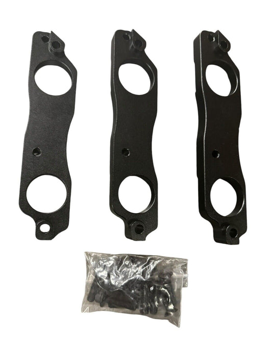 Black aluminum coil pack brackets for R35 GTR, compatible with Toyota 1JZ and 2JZ engines, by JackSpania Racing.