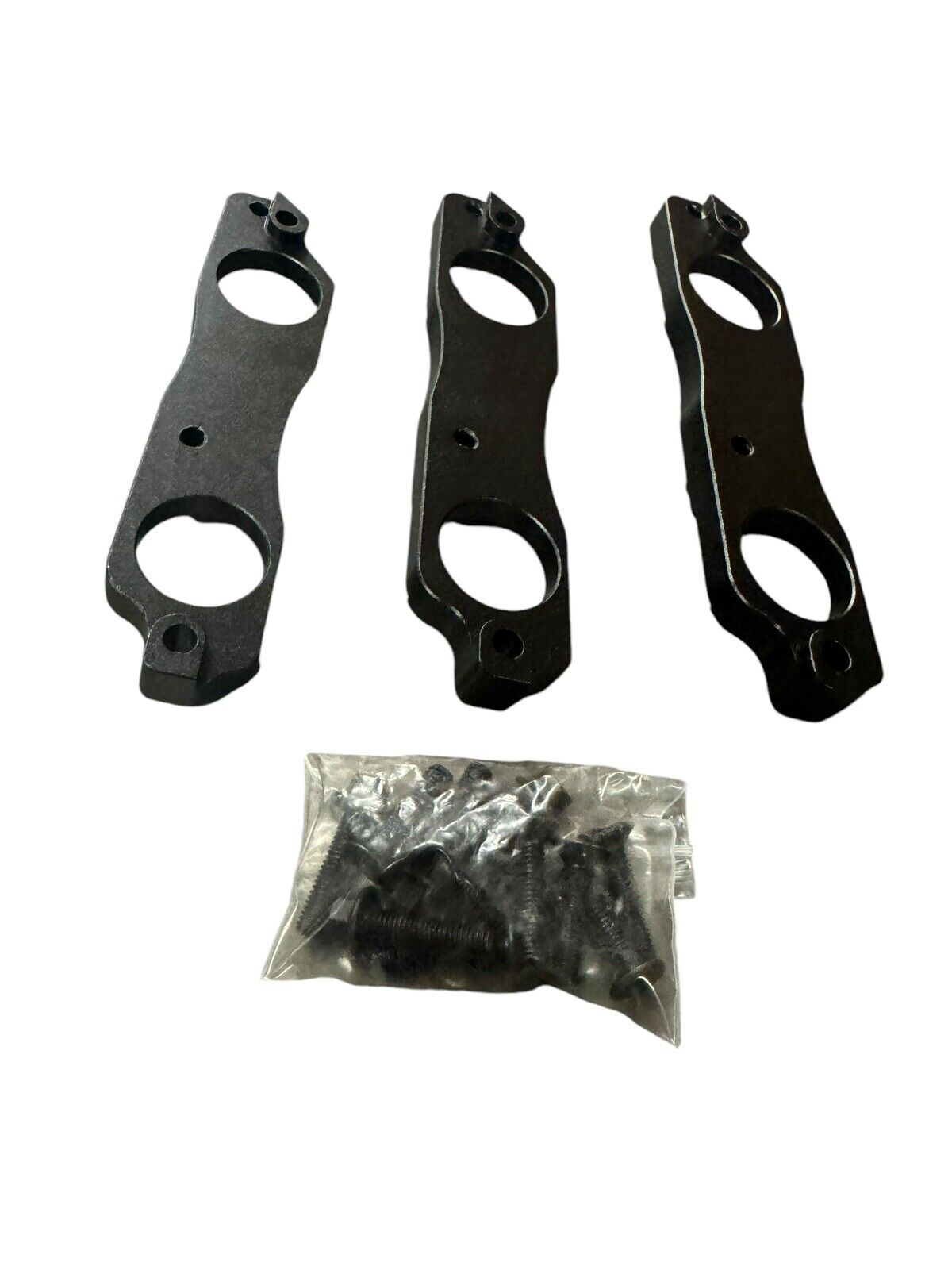 Black aluminum coil pack brackets for R35 GTR, compatible with Toyota 1JZ and 2JZ engines, by JackSpania Racing.