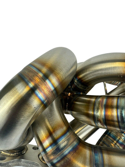 316SS tubular turbo manifold for Evo 7-9 with 44mm V-band wastegate, compatible with Garrett G25 G30, by JackSpania Racing.