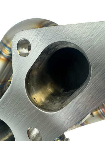 316SS tubular turbo manifold for Evo 7-9 with 44mm wastegate, V-band, compatible with Garrett G25 G30, by JackSpania Racing.