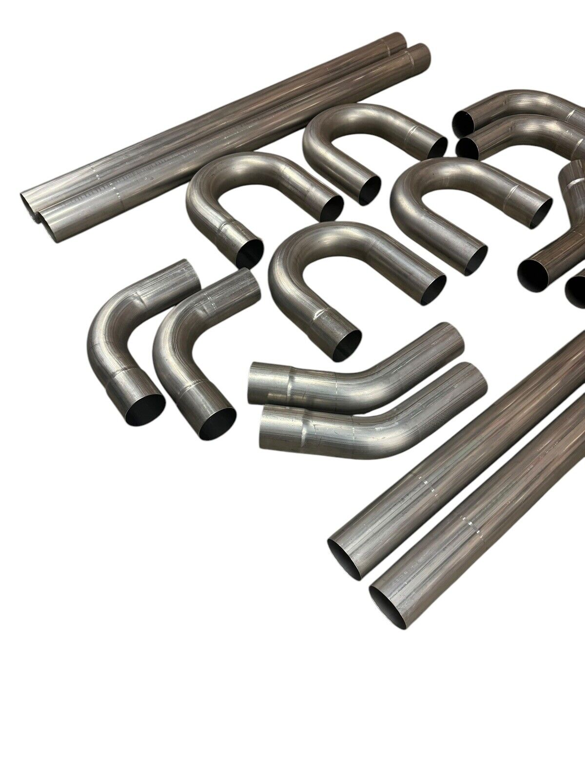 JackSpania Racing stainless steel exhaust manifold tubing, 3-inch straight and bent mandrel piping, 18 gauge SS for exhaust systems.