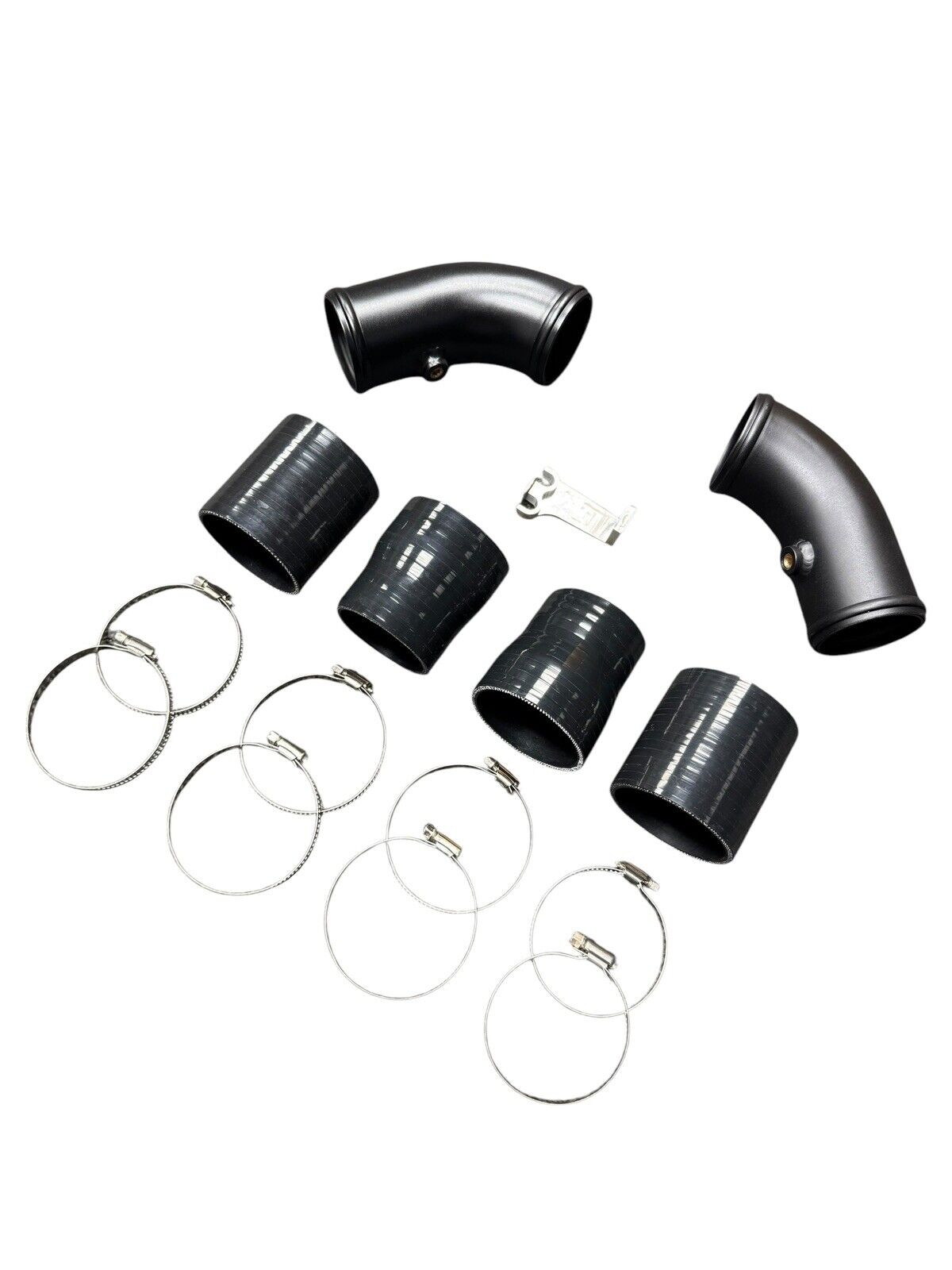 High Flow Turbo Charge Pipe Upgrade Kit for BMW F10 F12 F13 M5 M6 S63 engine from JackSpania Racing, showing polished metal pipes.