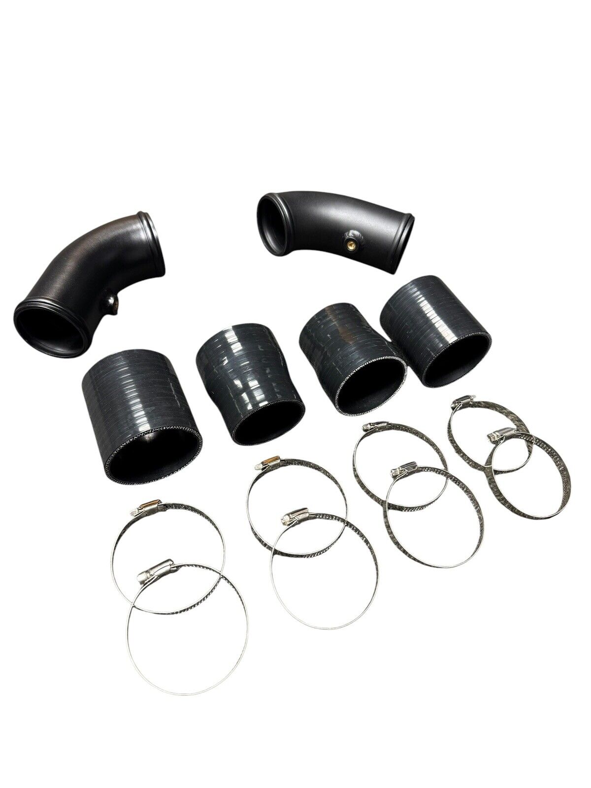 High flow turbo charge pipe upgrade kit for BMW F10 F12 F13 M5 M6 S63 engine, by JackSpania Racing, showing the polished pipe components.