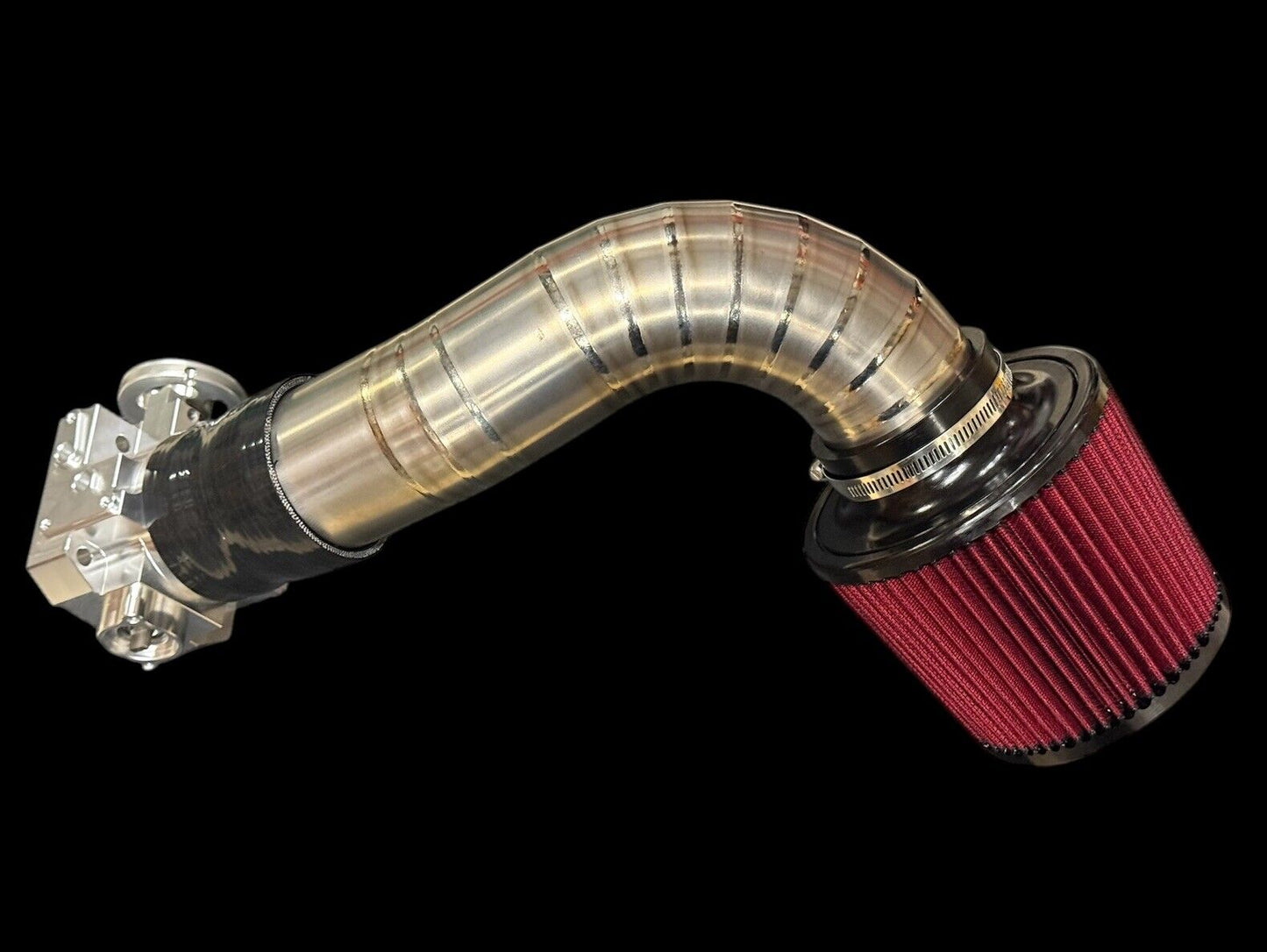 Titanium pie cut cold air intake pipe with high flow filter for K20 K24 K Swap engines, by JackSpania Racing, shown installed in engine bay.
