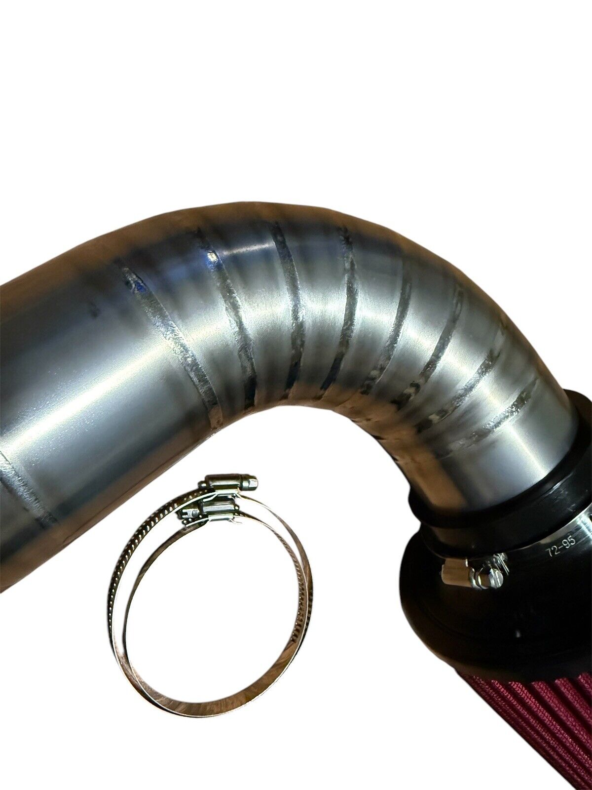 JackSpania Racing K20 K24 3-inch titanium pie cut cold air intake pipe with high flow filter installed in engine bay.