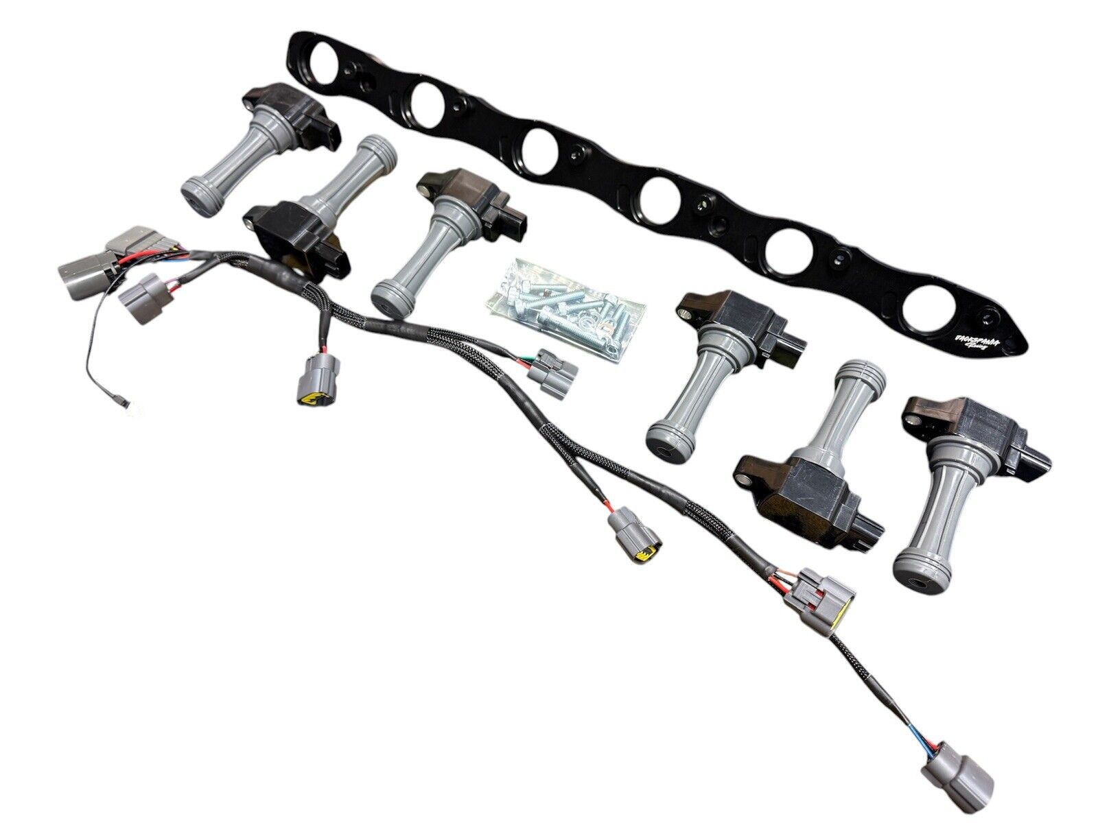 JackSpania Racing VR38 twin cam ignition coil conversion kit for Nissan RB R32 GTR engine parts, showing the coil components.