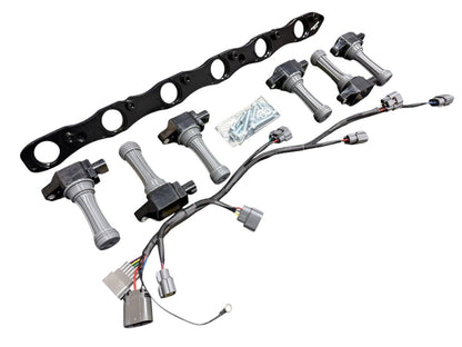 VR38 twin cam ignition coil conversion kit for Nissan RB R32 GTR engine, featuring JackSpania Racing branded engine parts.