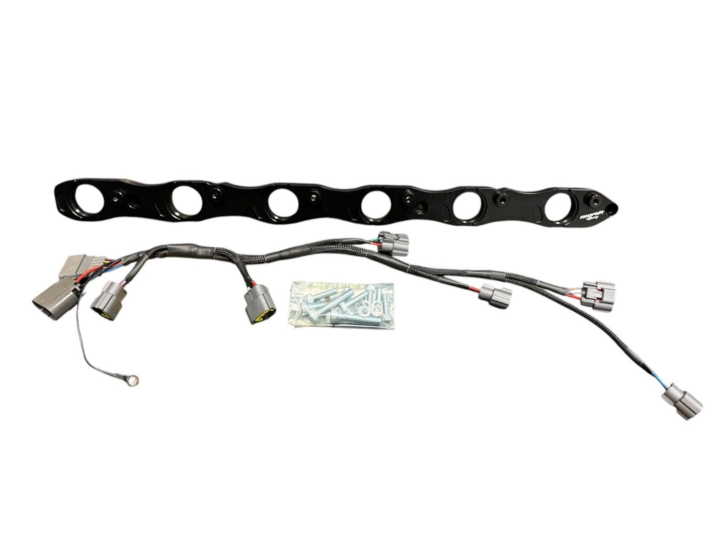 VR38 twin cam ignition coil conversion kit for Nissan RB R32 GTR engine, featuring high-performance coil packs by JackSpania Racing.