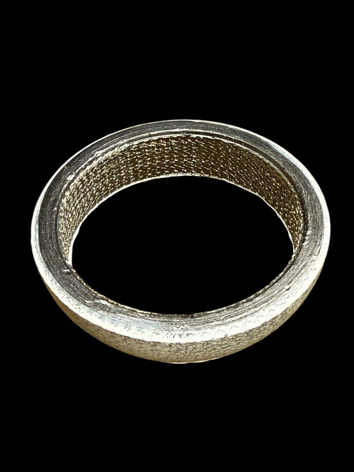 JackSpania Racing universal donut exhaust gasket in 2, 2.5, and 3-inch sizes, showing the gasket's rubber and metal construction.