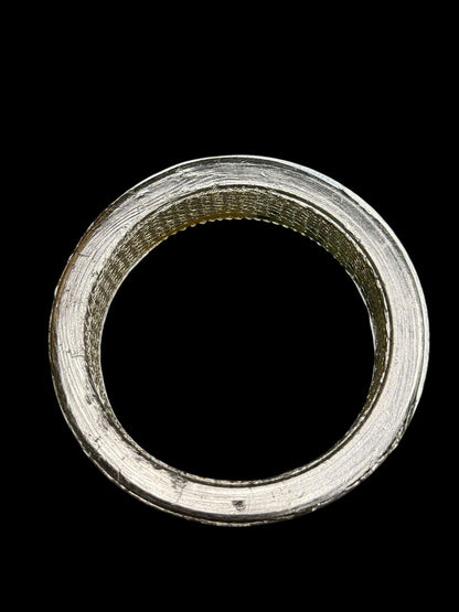 Universal JackSpania Racing donut exhaust gasket in 2, 2.5, or 3-inch sizes, showing the gasket's round shape and metal construction.