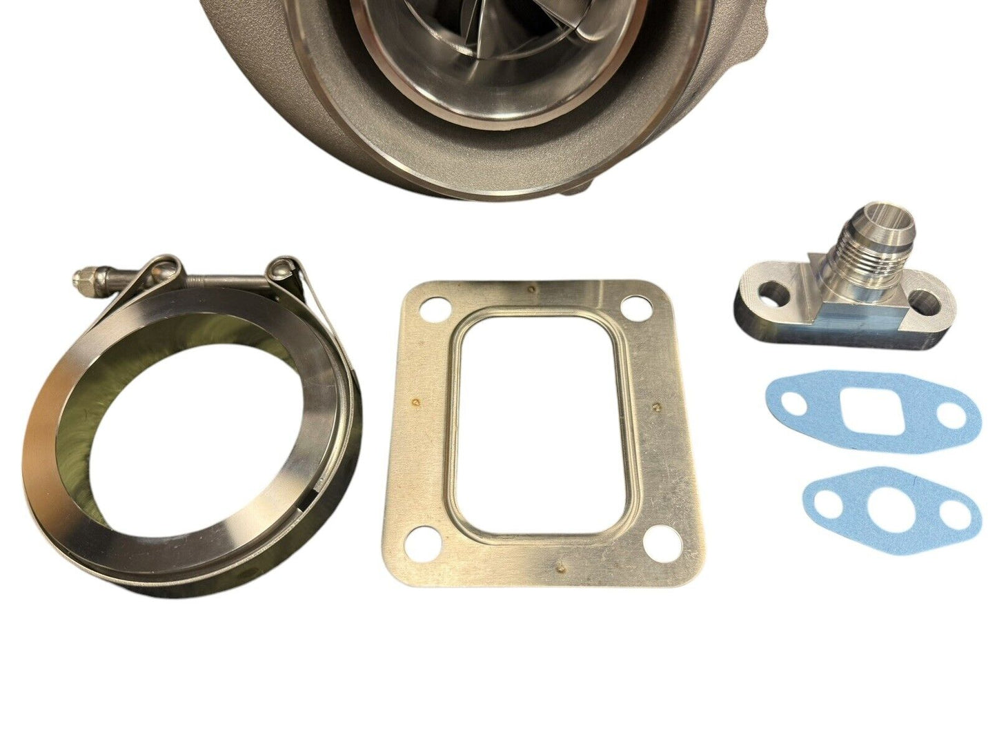 JackSpania Racing billet wheel turbo with T3 .82 T4 .81 dual V-band turbine housing, compatible with PTE 700HP engine applications.