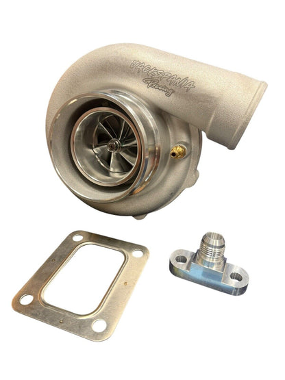 JackSpania Racing Billet Wheel Turbo T3 T4 dual V-band turbine housing for high-performance engine, compatible with PTE 700HP setups.