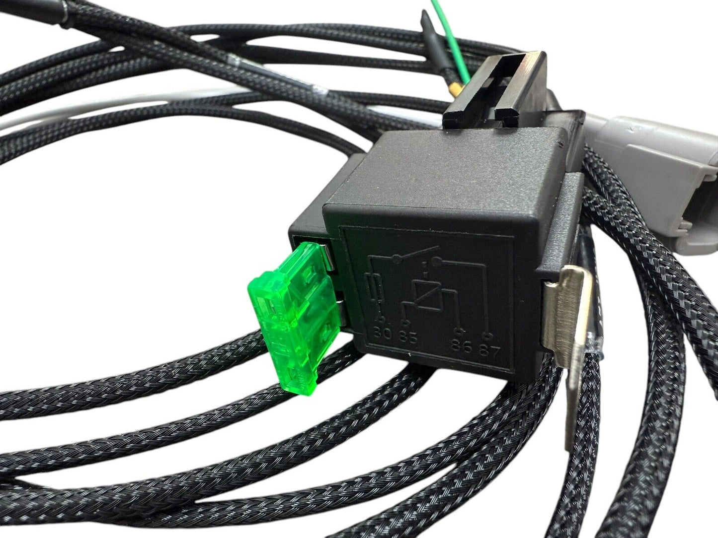 Universal fuel pump relay wiring harness for engine, by JackSpania Racing, showing detailed electrical connectors and wiring setup.